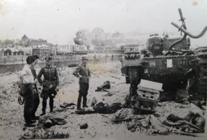 German personnel surveying an abandoned Allies tank. Courtesy of Ron Akines