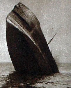Ship sinking stern first after being hit by a torpedo courtesy of the Doyle Collection Ship sinking stern first after being hit by a torpedo courtesy of the Doyle Collection