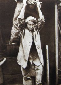Woman coalheaver carrying 1 cwt sack. Thanks to Eveline Robinson