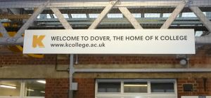 K-College advert on Dover Priory Station 2014