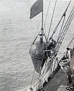 Dropping a marker buoy to show the start of a line that is being examined for a fault. Alan Sencicle Collection