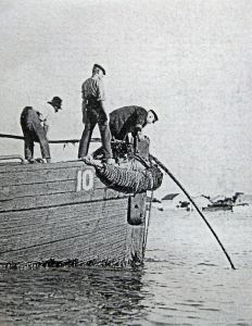 Shore end of a submarine cable paid out from a lighter. Alan Sencicle collection