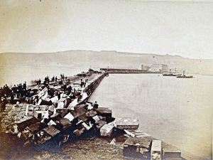 Admiralty Pier following storm damage on 1 January 1877 at the seaward end. Dover Library