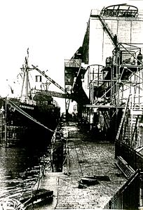 Corminster being loaded with coal from the giant staithe 14 Feb 1930 scaffold for the Southern Railway staith on right. Dover Museum