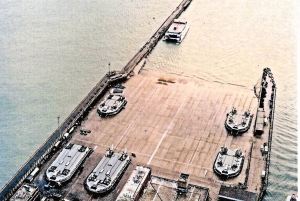 Hovercrafts on the Pad at Western Docks with a Seacat, in the sea, next to the Prince of Wales Pier. Brian Laverick-Smith