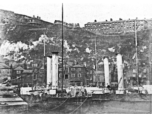 LCDR packet paddle steamers Samphire and Maid of Kent in Western Docks with the Western Heights Barracks on the cliffs behind. Dover Museum