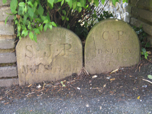 Boundary stones in Maison Dieu gardens representing St James and Charlton Parishes. There was once a third representing St Mary's Parish. LS