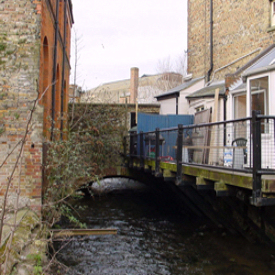 Town Mill bridge, Mill Lane and the Dour, there is evidence of medieval building. LS