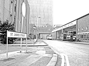 Bus garage in St James Street with the back of the Holiday Inn on the left and Burlington House straight ahead c 1975. Dover Museum