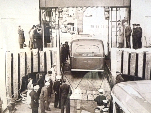 Loading an East Kent Road Car Company pre-war Leyland TD5 rebuilt as a 35 seater single decker by Beadles on to Townsend's Halladale on 11 May 1953 at Eastern Dockyard trying out the new drive-on drive-off facility. Lambert Weston for DHB