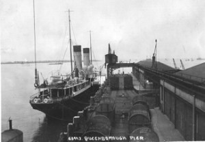 Queenborough Pier with a ship tied up alongside. Guildhall Museum Queenborough
