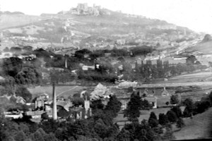 NB River village c1895. River paper mill chimney with St Peter's Church to the right Dover Castle in distance. Dover Museum