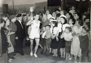 Sidney Doble carrying the Olympic Torch through Dover following arrival on HMS Bicester 28 July 1948 pix Graphic Union. Dover Library