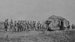 A Mark 1 tank first used at the Battle of Fleurs-Courcelette 15.09.1916 with infantry soldiers. Tom Robinson Collection