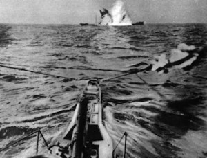 A torpedo hitting a merchant vessel showing the weapon's destructveness. I.W.M.