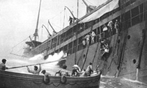 Crew of a doomed merchant vessel leaving their ship after being torpedoed by the Germans. Cossira