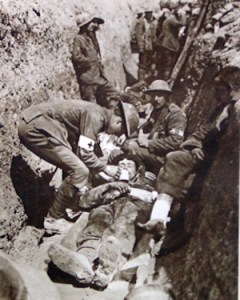Non-combatant stretcher bearers in the trenches giving first aid at the Somme 1916. I.W.M